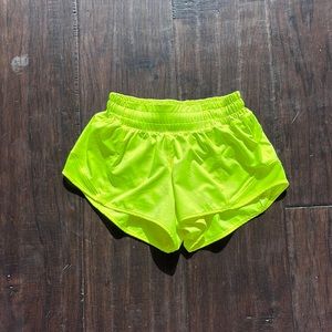 Neon yellow, lululemon hotty hot shorts.